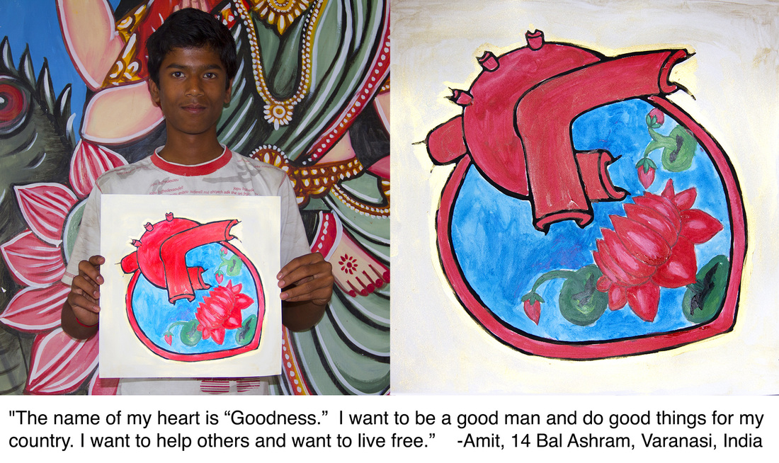 Amit, 14, of Bal Ashram Orphanage Varanasi holding his heart painting named Goodness at the Hearts of the World workshop